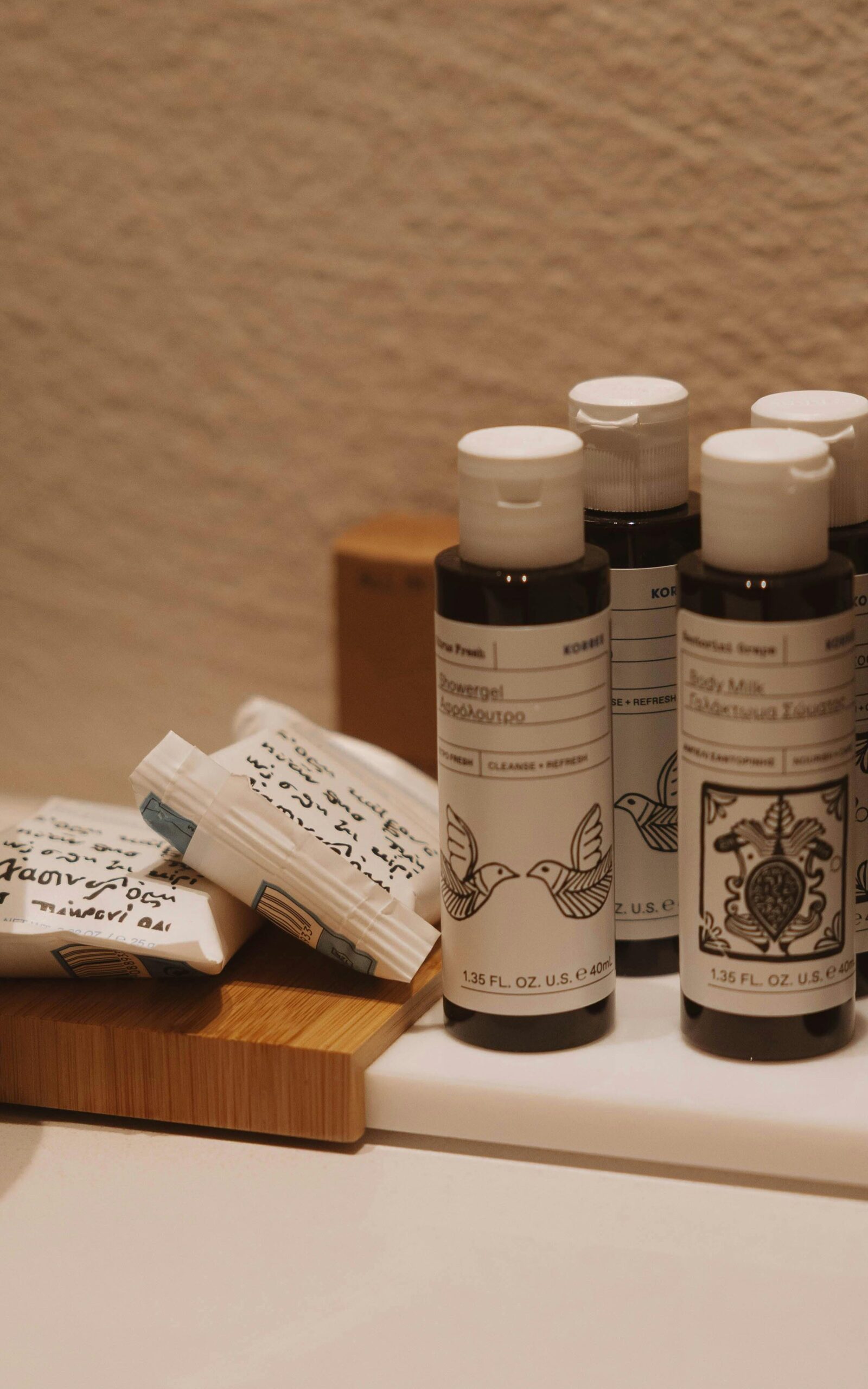 Elegant hotel toiletries elegantly arranged with artisanal soaps in warm lighting.