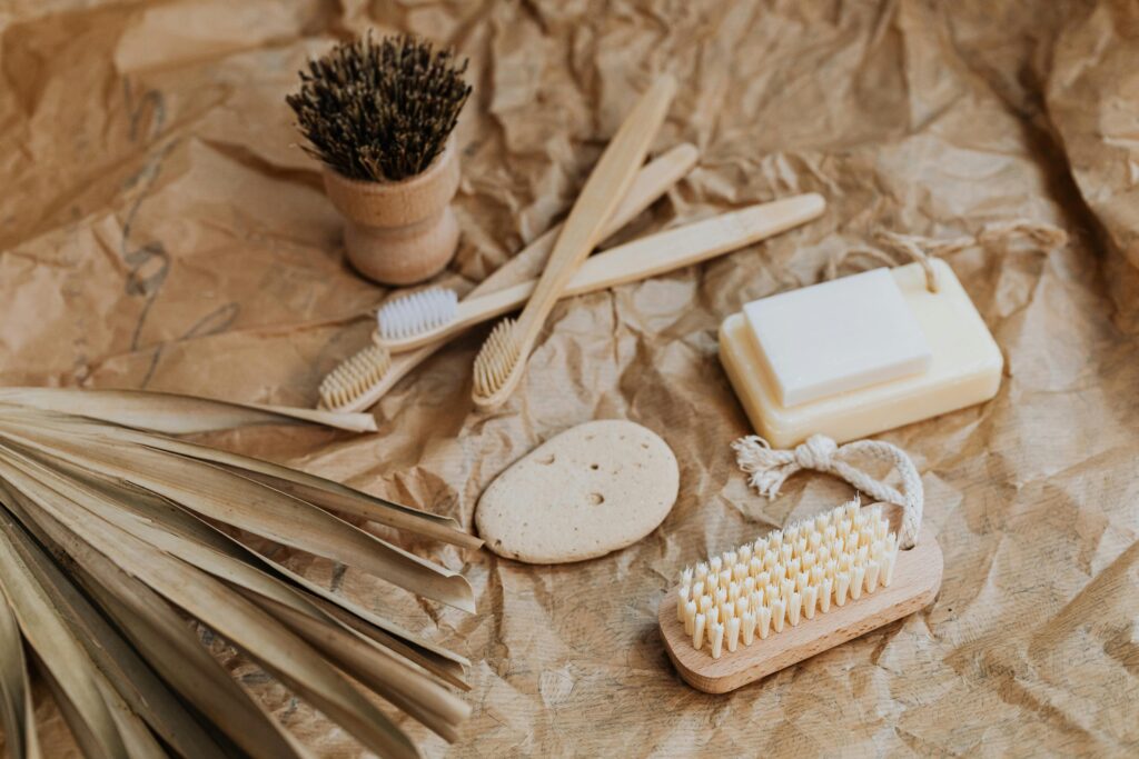 Collection of natural bath products on a rustic brown paper background, emphasizing sustainability.