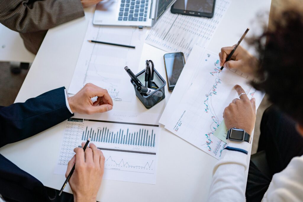 pexels-photo-7698796-7698796 Business team analyzing financial charts and graphs during a collaborative meeting.